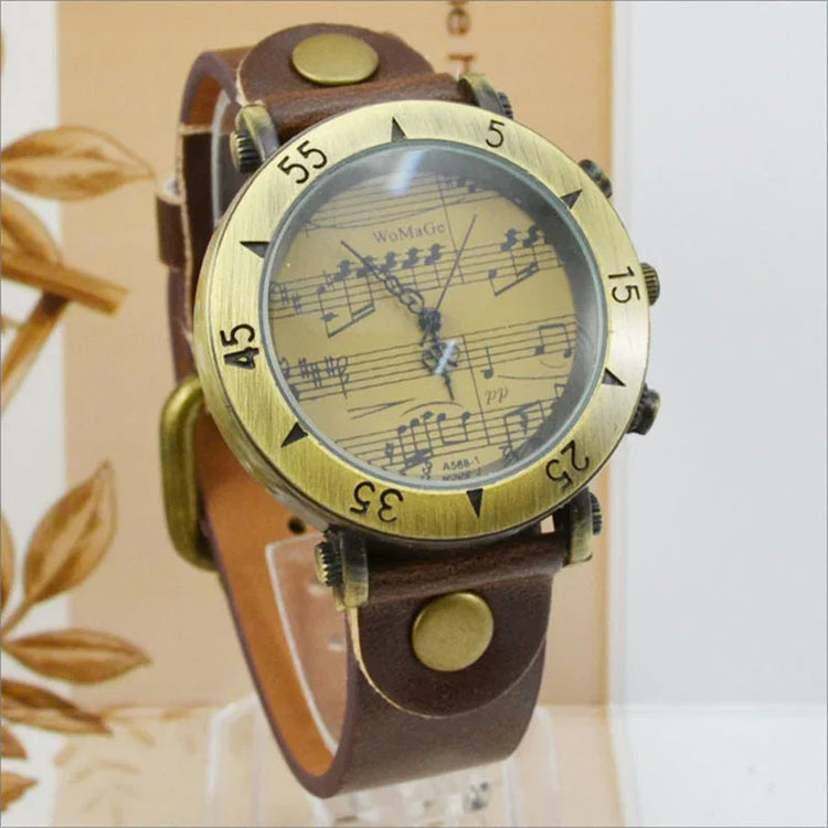 Vintage-style watch with brown leather strap, brass bezel, and musical notes on dial