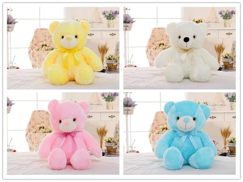 Set of pastel plush teddy bears in yellow, white, pink, and blue with satin bows.