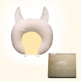 Soft beige ergonomic neck pillow with horn accents, plush texture, and contour fit design
