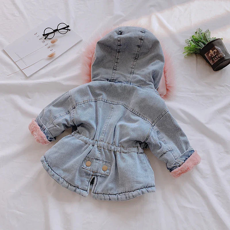 Light blue denim jacket with hood, pink faux fur trim, relaxed fit, and button details