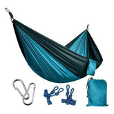 Lightweight teal and black nylon hammock set with carabiners, ropes, and carry bag