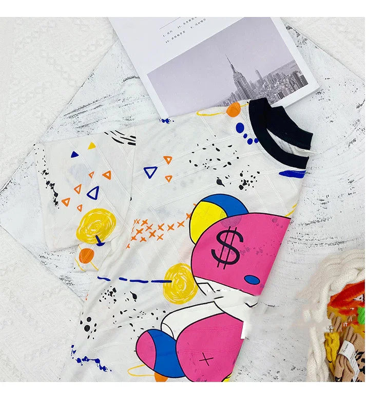 White graphic t-shirt with colorful cartoon bear print, abstract geometric shapes, relaxed fit