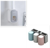 Modern bathroom set with wall-mounted soap dispenser and pastel toothbrush holders