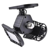 Black adjustable LED garage light with three foldable panels and E26 base