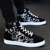Black and white high-top sneakers with abstract graphic pattern, lace-up streetwear style