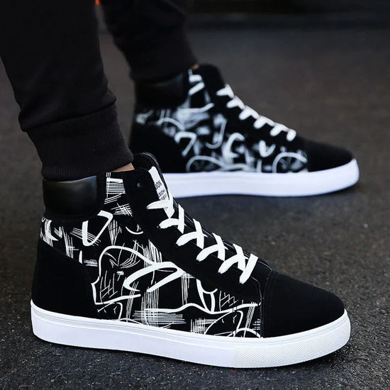 Black and white high-top sneakers with abstract graphic pattern, lace-up streetwear style