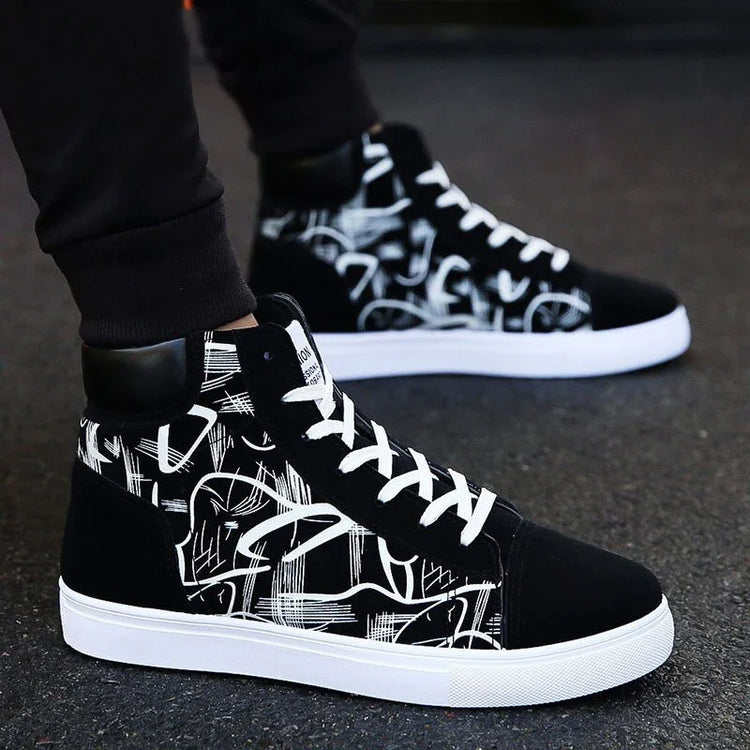 Black and white high-top sneakers with abstract graffiti design and white soles