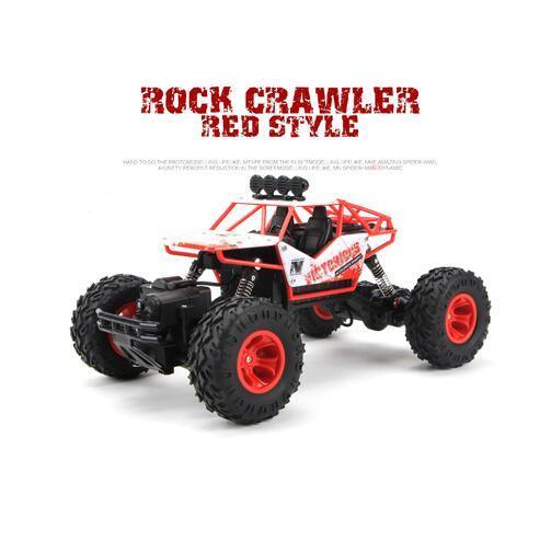 Red and white remote control rock crawler truck with large off-road tires on white background