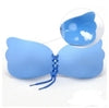Light blue silicone strapless bra with lace-up front, seamless design, and adhesive cups for invisible support