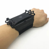 Black adjustable wrist strap phone holder with elastic bands and secure fit, worn on wrist