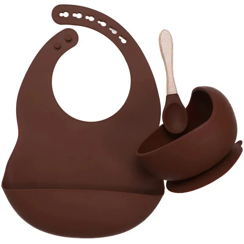 Brown silicone baby bib, suction bowl, and wooden-handled spoon set, modern style