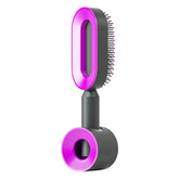 Futuristic black and purple hair dryer brush with oval vent and bristle design, sleek matte finish