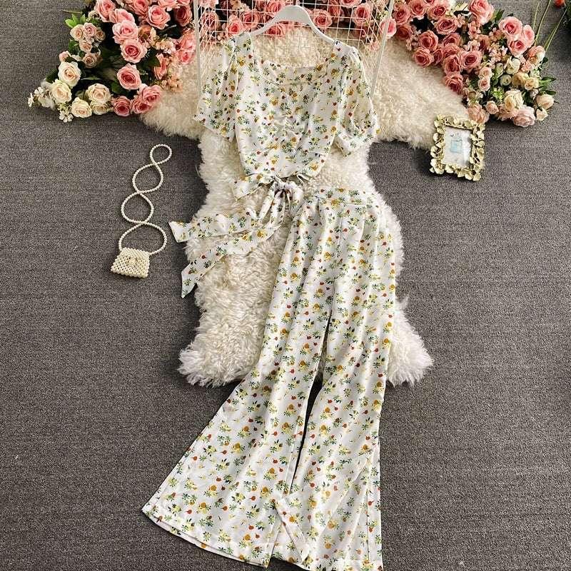 White floral print two-piece set with short sleeve top and wide leg pants, lightweight, relaxed fit