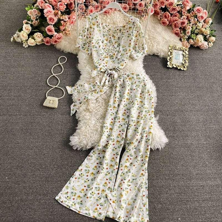 White floral print two-piece set with short sleeve top and wide leg pants, lightweight, relaxed fit