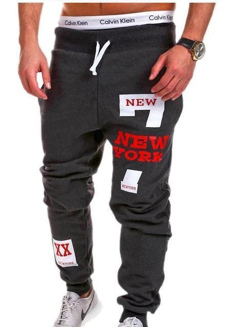 Men's dark grey jogger pants with red New York graphic, drawstring waist, relaxed fit streetwear