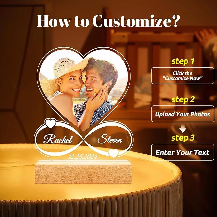 Custom heart-shaped acrylic photo lamp with names and date, warm ambient setting.