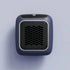 Compact dark gray portable heater with digital display and honeycomb vent design