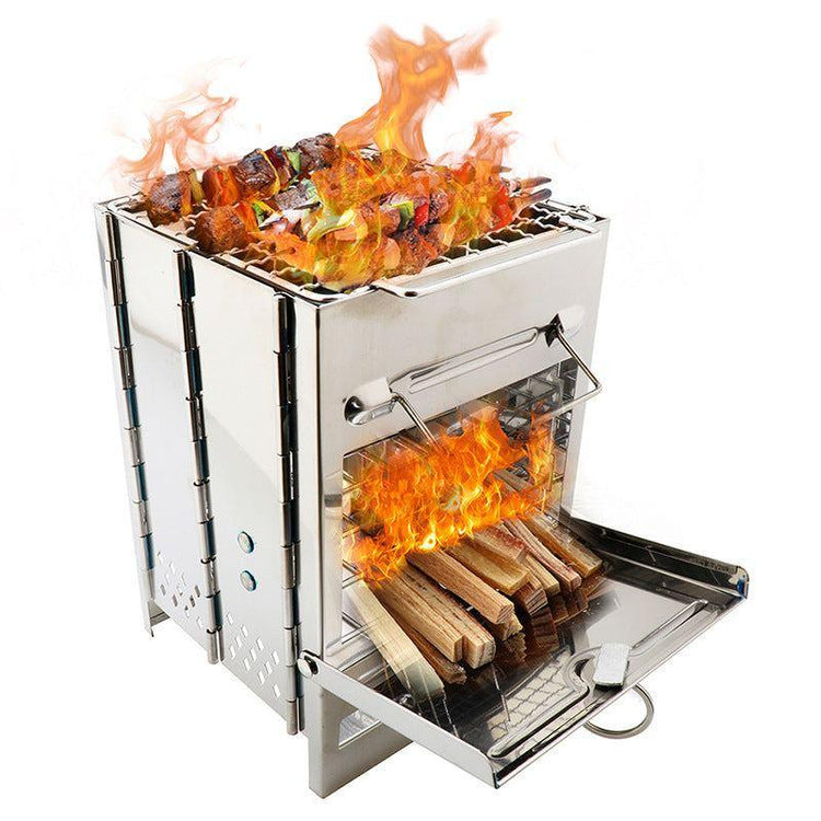 Stainless steel portable wood-burning grill with open flames and skewered kebabs on top
