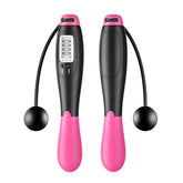 Pink and black digital cordless jump rope with ergonomic handles and built-in counter display