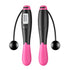 Pink and black digital cordless jump rope with ergonomic handles and built-in counter display
