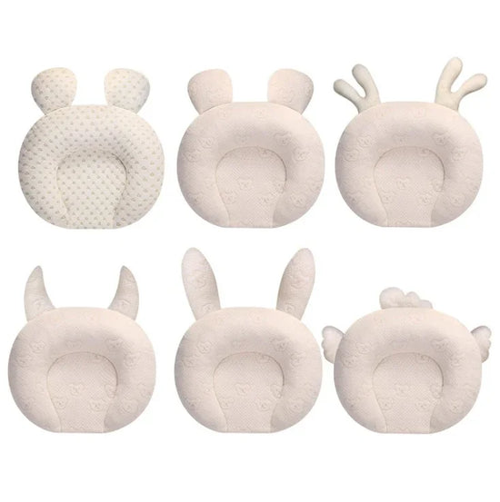 Six cream-colored plush cushions with animal ear shapes, soft fabric, round design