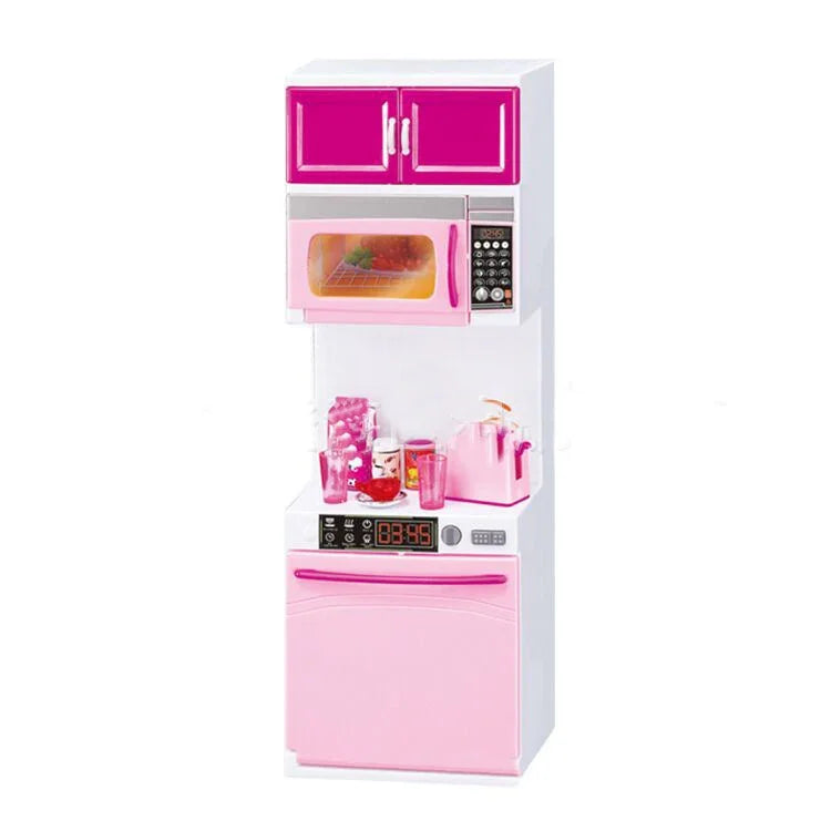 Miniature pink and white kitchen playset with microwave, cabinet, and accessories
