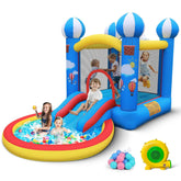 Kids playing on a blue and yellow inflatable bounce house with slide and splash pool