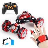 Black and red remote control stunt car with gesture control wristband, USB charger, and battery.