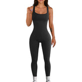 Woman in black ribbed sleeveless jumpsuit, form-fitting streetwear style, seamless design