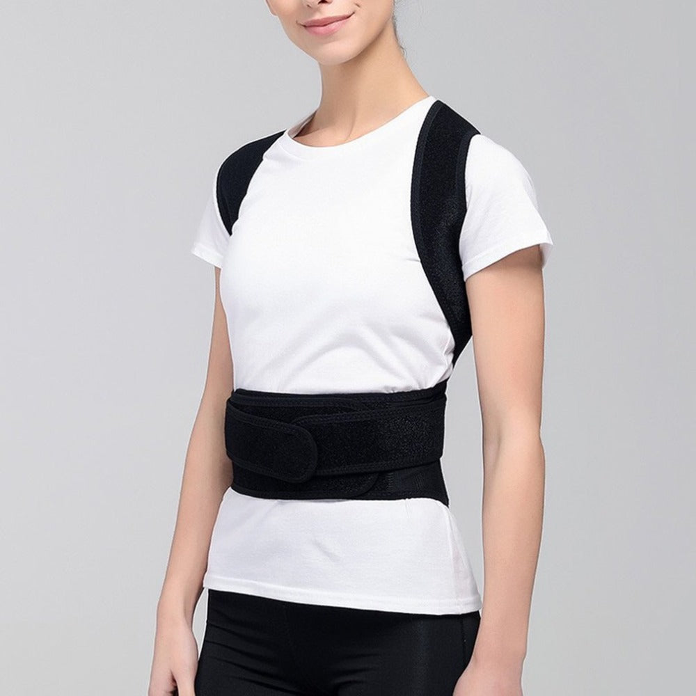 Woman wearing black spine bending posture corrector brace over white shirt
