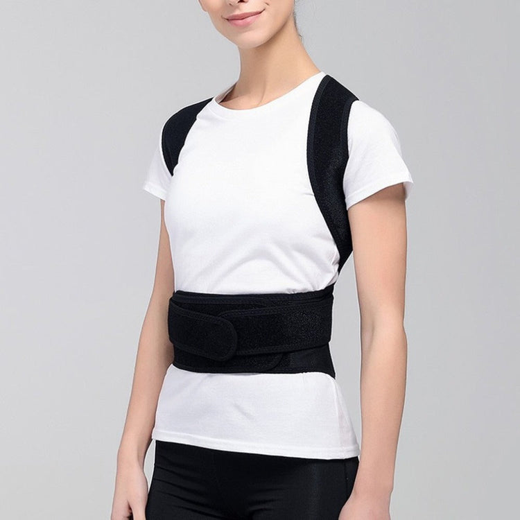 Woman wearing black spine bending posture corrector brace over white shirt