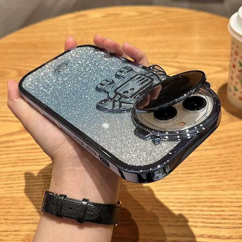 Glitter silver robot phone case with raised design and glossy finish, held in hand.
