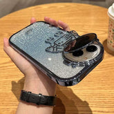 Glitter silver robot phone case with raised design and glossy finish, held in hand.