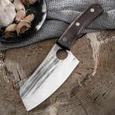 Stainless steel cleaver knife with dark wood handle and textured blade on rustic wood surface
