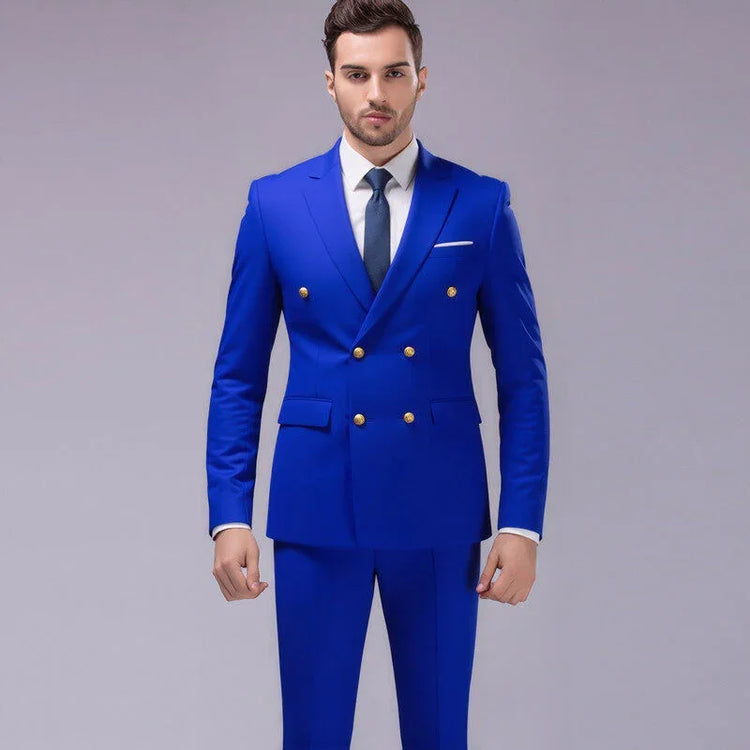 Man wearing slim fit royal blue double-breasted suit with gold buttons and white shirt