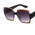 Square oversized sunglasses with brown glitter frame, black arms, and gradient lenses.
