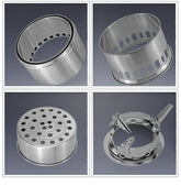 Four stainless steel stove or burner components with perforated cylindrical designs on a gray background.