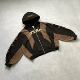 Brown and black oversized zip-up hoodie with abstract graphic print and front pockets
