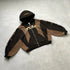 Brown and black oversized zip-up hoodie with abstract graphic print and front pockets