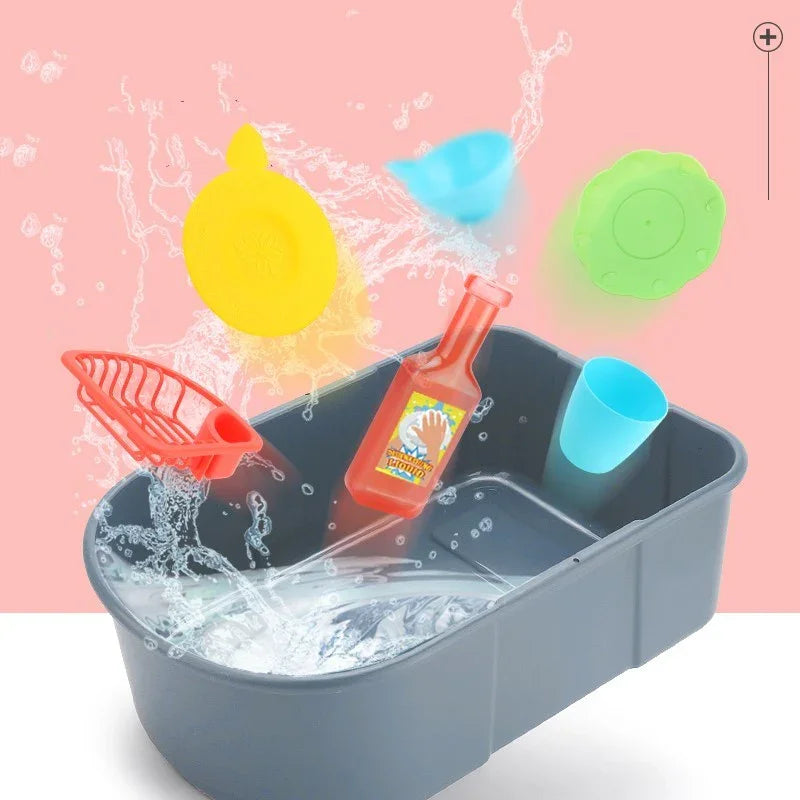 Colorful plastic kitchen toys and accessories splashing in a gray water basin, pink background.