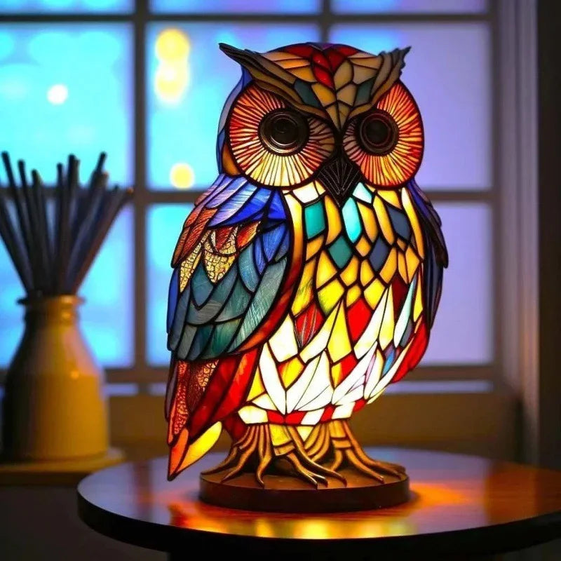 Colorful stained glass owl lamp with intricate mosaic design on table indoors