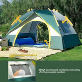 Green and yellow ventilated camping tent with mesh windows, outdoor picnic setup, summer use.