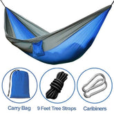 Blue and gray nylon hammock with carry bag, 9-foot tree straps, and carabiners included.