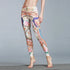 Colorful high-waisted stretch leggings with ornate floral and bird print, slim fit