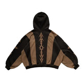Oversized black and brown hoodie with bold graphic patterns and wide sleeves, relaxed fit.