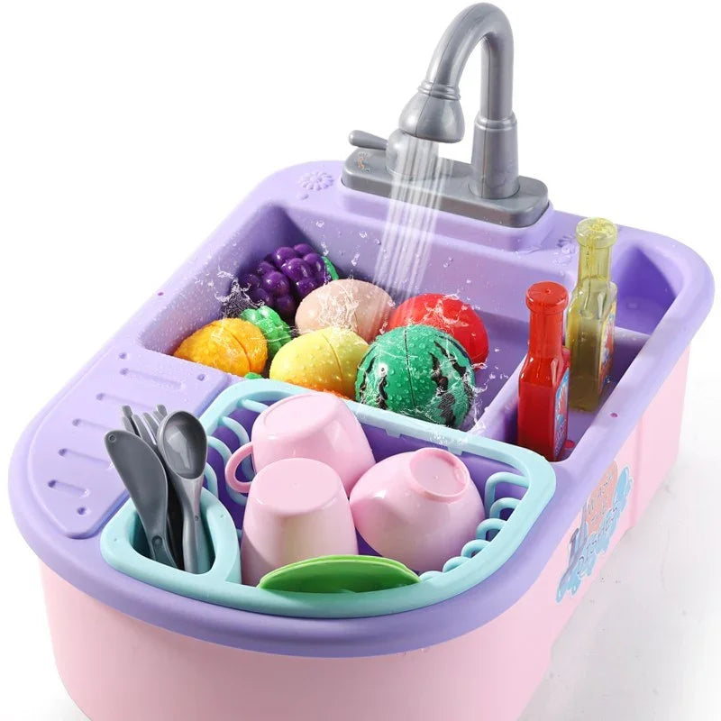 Colorful plastic toy kitchen sink with utensils, cups, and play food under running water