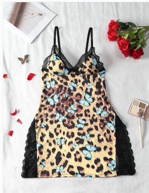 Leopard print slip dress with blue butterfly pattern, black lace trim, and adjustable straps