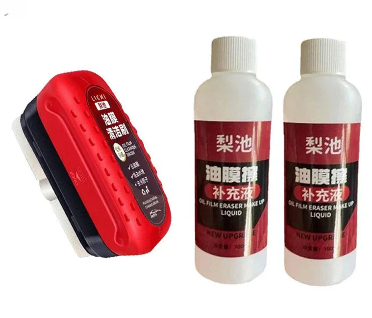 Red and black cleaning sponge with two bottles of oil film eraser liquid for surfaces