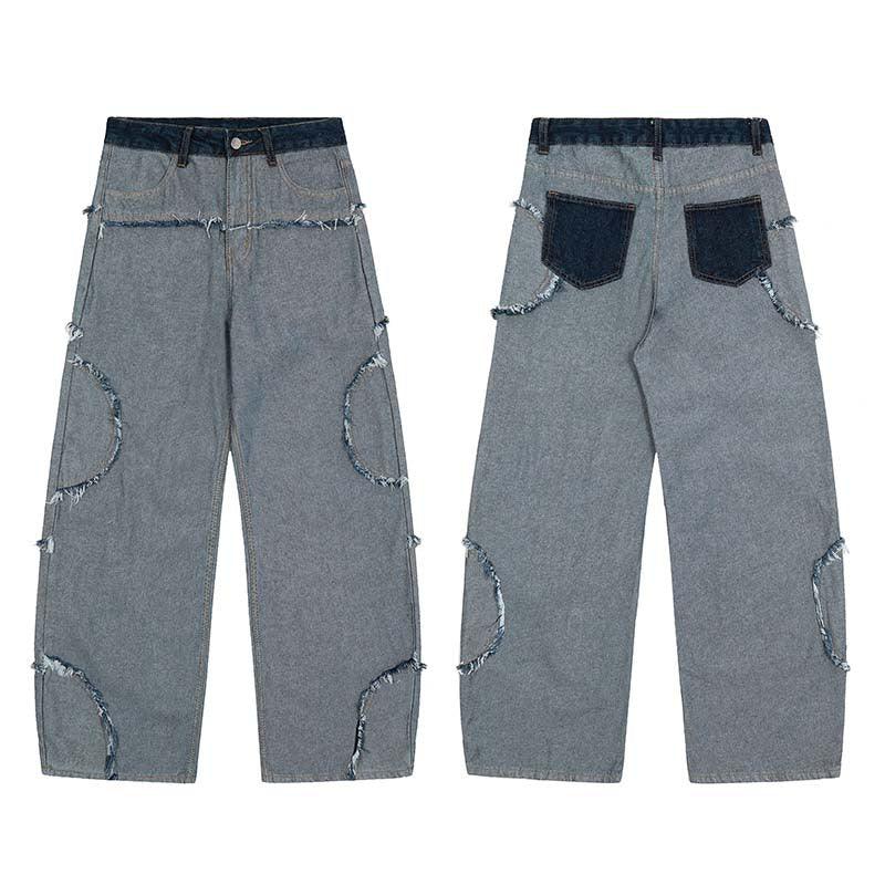 Wide-leg gray denim jeans with raw edge details, patchwork pockets, and relaxed fit.