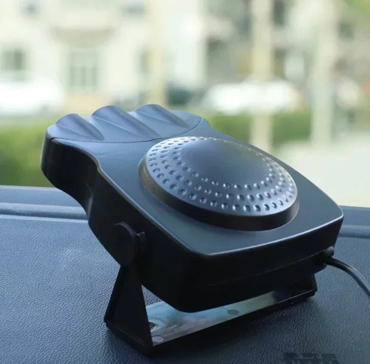 Black portable car heater and defroster with vented design on dashboard